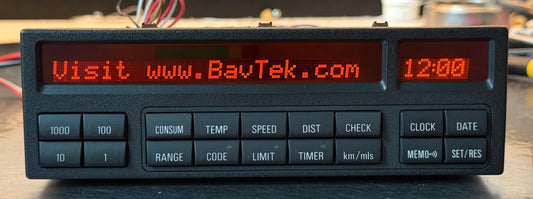 Digital display with text and buttons on a dark surface