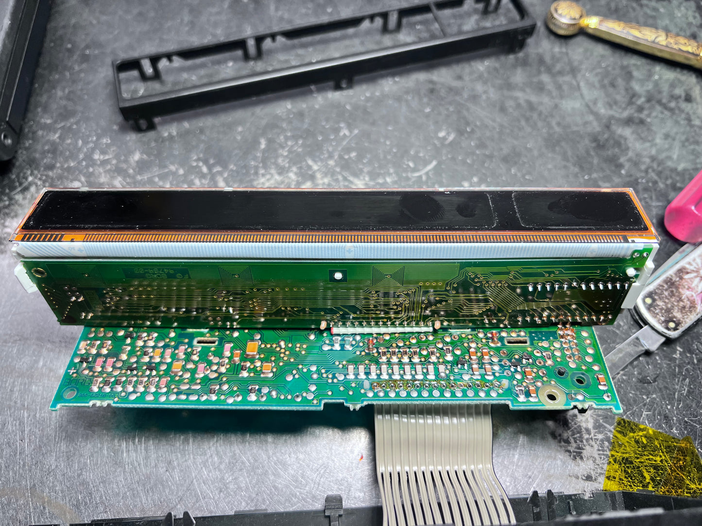 Electronic circuit board with connectors on a gray surface
